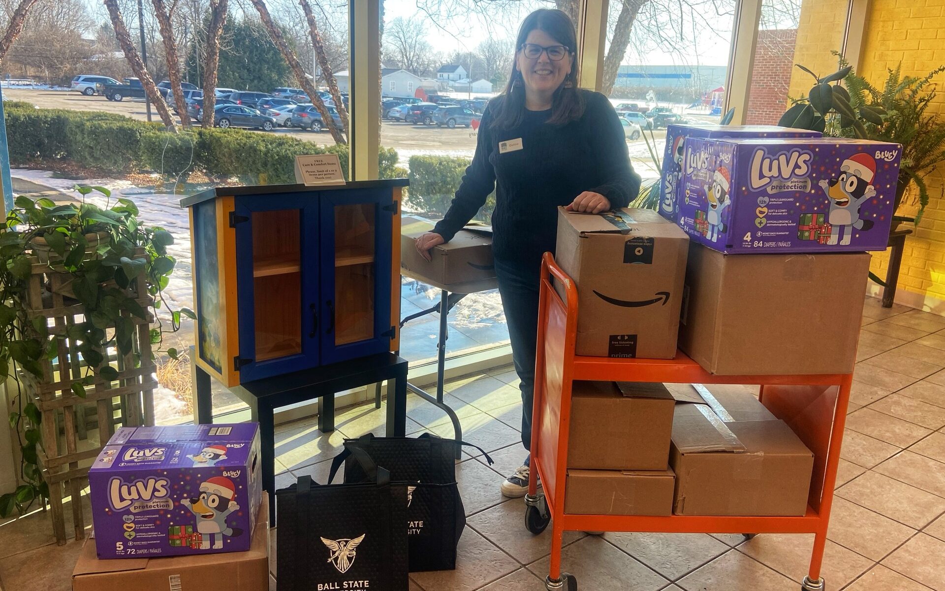 Dottie Kreps, Community Engagement Specialist accepting CPS donations for the Maring-Hunt Location